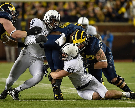 De'Veon Smith (4) and Mason Cole (52)