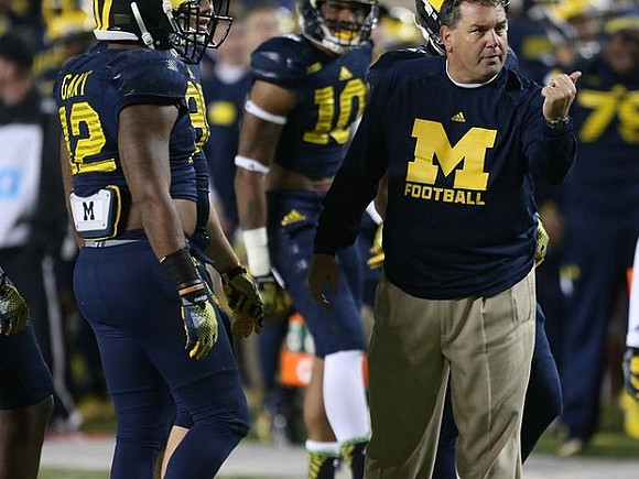 Allen Gant (12), Brady Hoke, and Da'Mario Jones (10)
