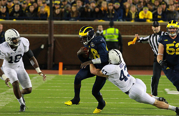 Devin Gardner (98) and Mason Cole (52)