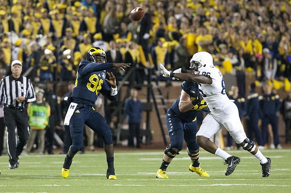 Devin Gardner (98) and Mason Cole (52)