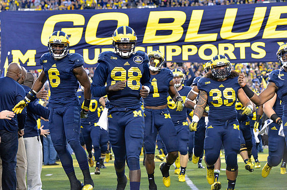 Raymon Taylor (6), Devin Gardner (98), Devin Funchess (1), and Sione Houma (39)