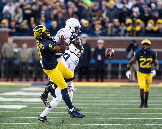 Donovan Peoples-Jones (9) and Karan Higdon (22)