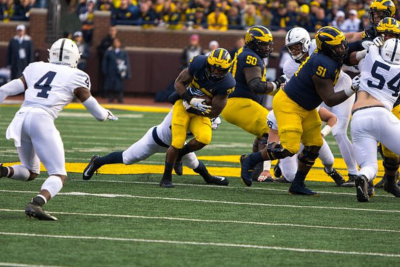 Karan Higdon (22), Michael Onwenu (50), and Cesar Ruiz (51)