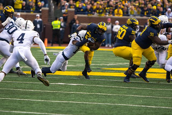 Karan Higdon (22), Michael Onwenu (50), and Cesar Ruiz (51)