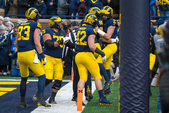 Zach Gentry (83), Jon Runyan Jr. (75), Ben Mason (42), Oliver Martin (80), and Shea Patterson (2)