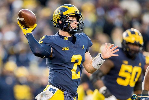 Shea Patterson (2) and Michael Onwenu (50)