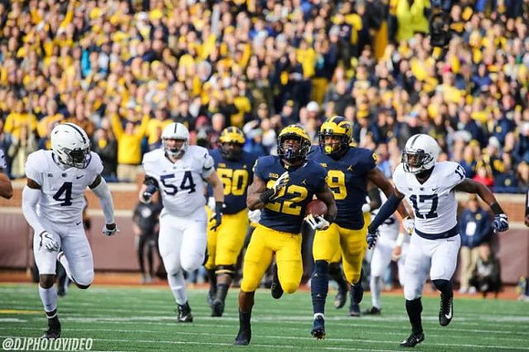 Michael Onwenu (50), Karan Higdon (22), and Donovan Peoples-Jones (9)