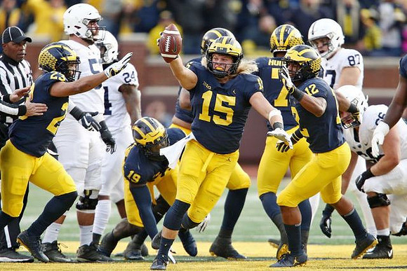 Tyree Kinnel (23), Kwity Paye (19), Chase Winovich (15), Khaleke Hudson (7), and Josh Ross (12)