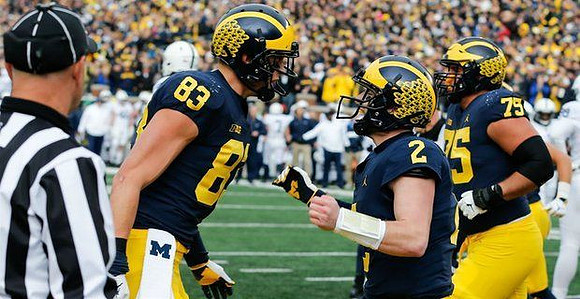 Zach Gentry (83), Shea Patterson (2), and Jon Runyan Jr. (75)