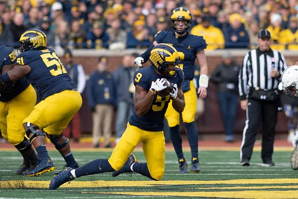 Michael Onwenu (50), Cesar Ruiz (51), Donovan Peoples-Jones (9), and Shea Patterson (2)