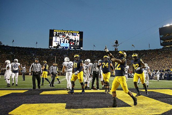 Zach Gentry (83), Cesar Ruiz (51), Ben Bredeson (74), Karan Higdon (22), and Nick Eubanks (82)
