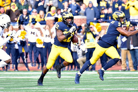 Karan Higdon (22) and Donovan Peoples-Jones (9)