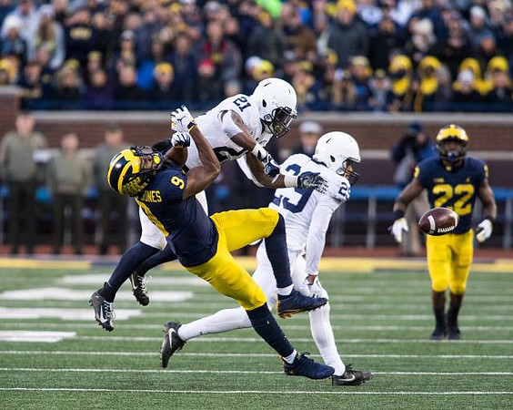 Donovan Peoples-Jones (9) and Karan Higdon (22)