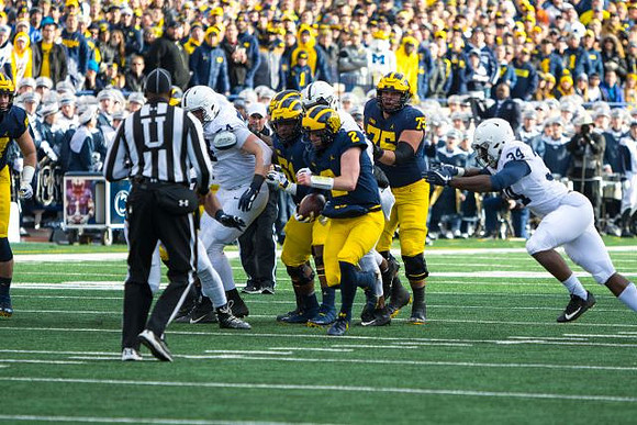 Cesar Ruiz (51), Shea Patterson (2), and Jon Runyan Jr. (75)