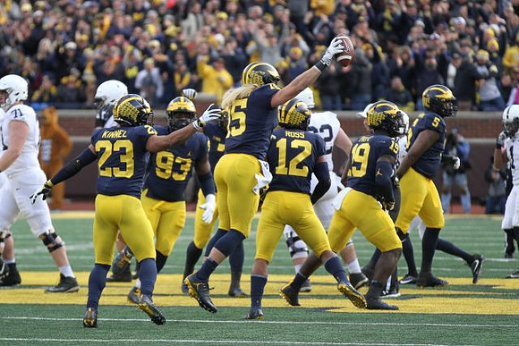 Tyree Kinnel (23), Lawrence Marshall (93), Chase Winovich (15), Josh Ross (12), Kwity Paye (19), and Aubrey Solomon (5)