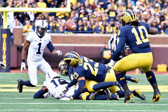 Tyree Kinnel (23) and Devin Bush (10)