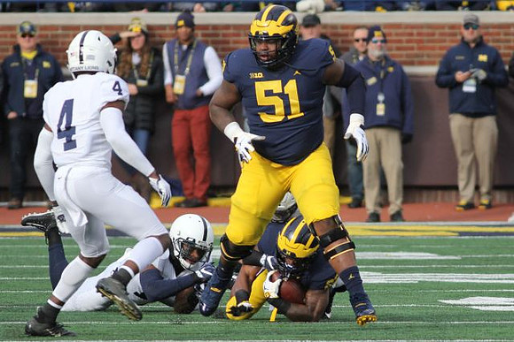 Cesar Ruiz (51) and Karan Higdon (22)