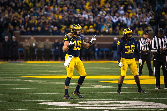 Chase Winovich (15) and Devin Gil (36)