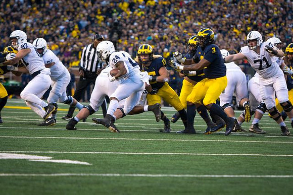Chase Winovich (15) and Rashan Gary (3)