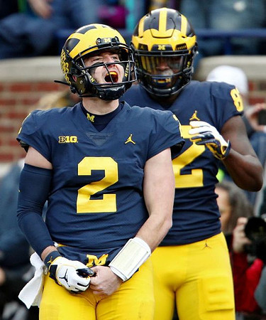 Shea Patterson (2) and Nick Eubanks (82)