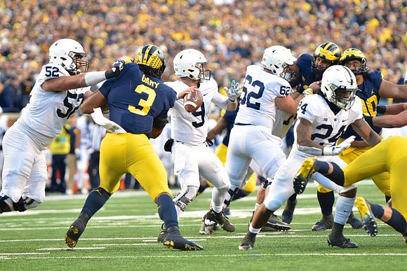 Rashan Gary (3) and Bryan Mone (90)