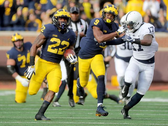 Ben Bredeson (74), Karan Higdon (22), and Donovan Peoples-Jones (9)