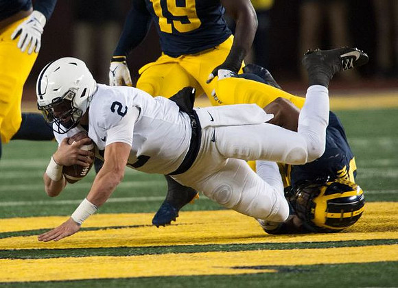 Kwity Paye (19) and Khaleke Hudson (7)