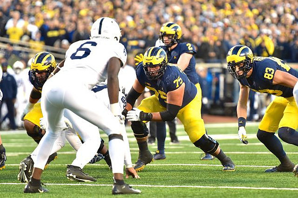 Jon Runyan Jr. (75), Shea Patterson (2), and Zach Gentry (83)