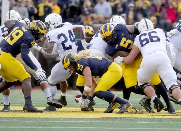 Kwity Paye (19), Chase Winovich (15), and Aubrey Solomon (5)
