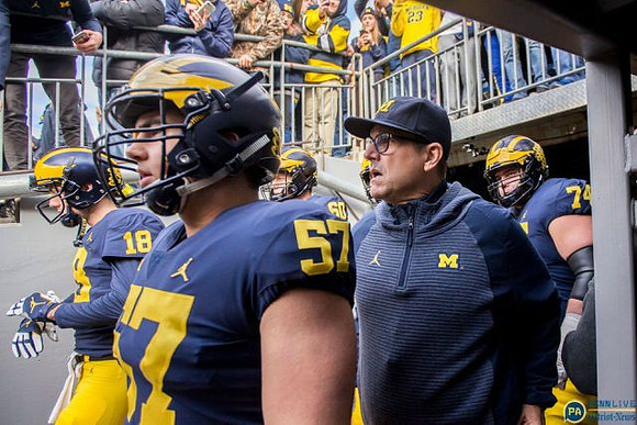 Brandon Peters (18), Joey George (57), Jim Harbaugh, and Ben Bredeson (74)