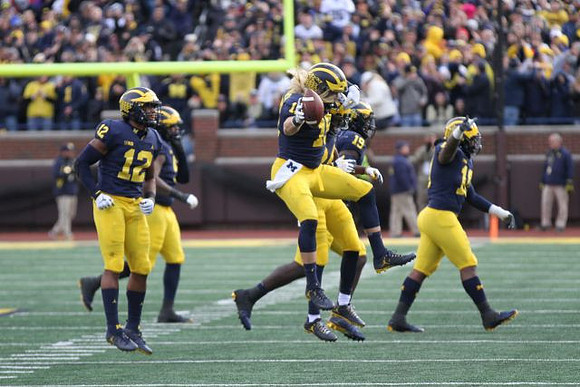 Josh Ross (12), Chase Winovich (15), Kwity Paye (19), and Devin Bush (10)