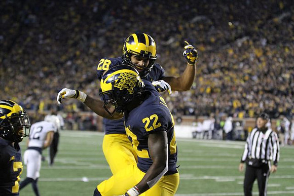 Khaleke Hudson (7), Brandon Watson (28), and David Long (22)