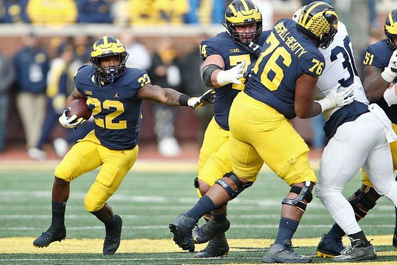 Karan Higdon (22), Ben Bredeson (74), Juwann Bushell-Beatty (76), and Cesar Ruiz (51)