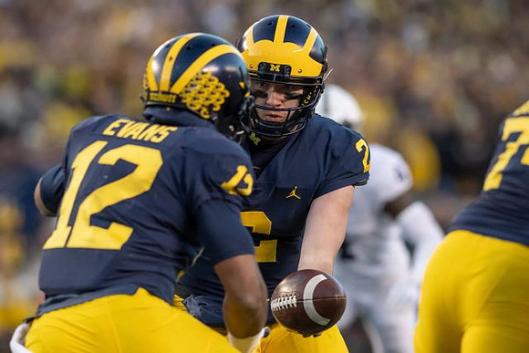 Chris Evans (12) and Shea Patterson (2)
