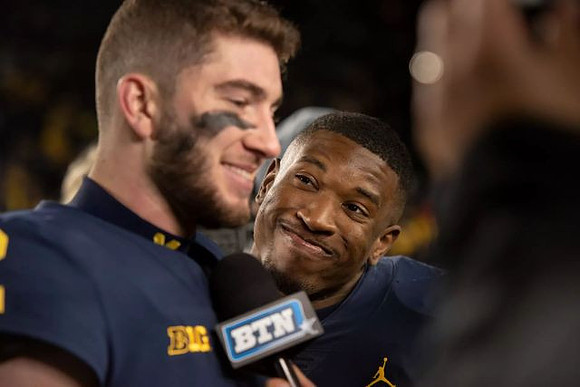 Shea Patterson (2) and Karan Higdon (22)