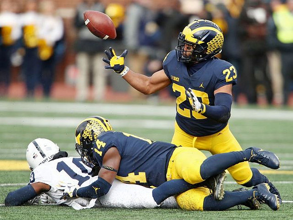 Josh Metellus (14) and Tyree Kinnel (23)