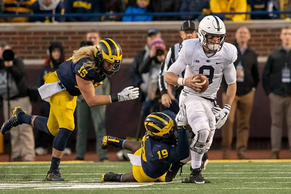 Chase Winovich (15) and Kwity Paye (19)