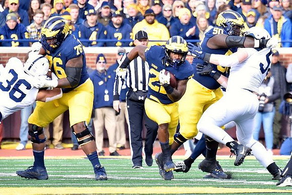 Juwann Bushell-Beatty (76), Karan Higdon (22), and Michael Onwenu (50)