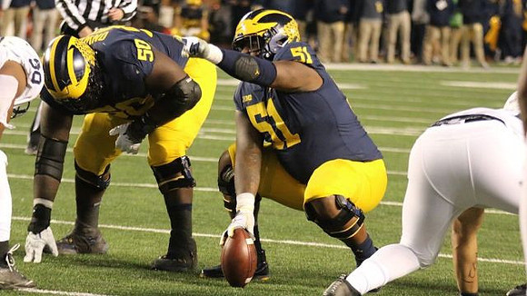 Michael Onwenu (50) and Cesar Ruiz (51)