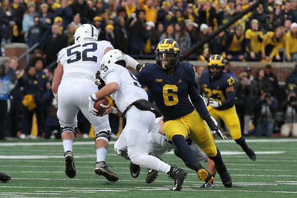 Josh Uche (6) and Tyree Kinnel (23)