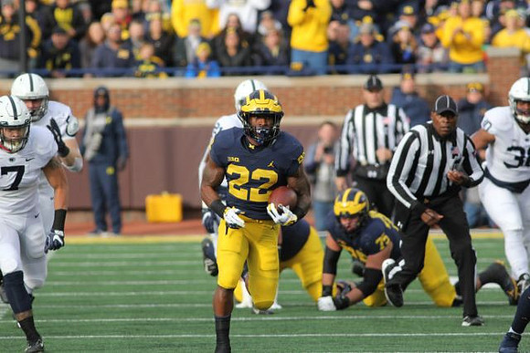 Karan Higdon (22) and Jon Runyan Jr. (75)
