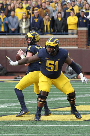 Shea Patterson (2) and Cesar Ruiz (51)