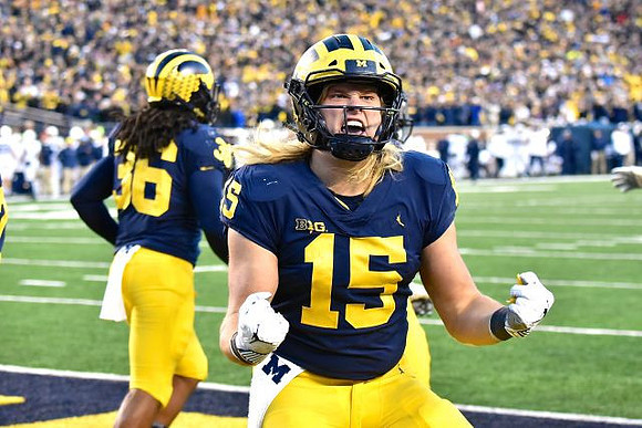 Devin Gil (36) and Chase Winovich (15)