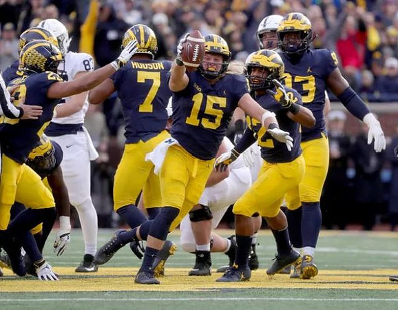 Aubrey Solomon (5), Tyree Kinnel (23), Khaleke Hudson (7), Chase Winovich (15), Josh Ross (12), and Lawrence Marshall (93)