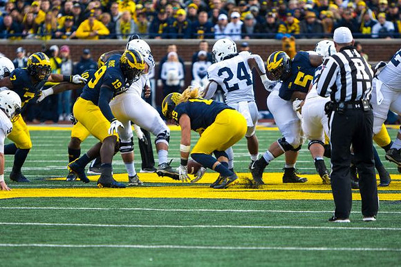 Khaleke Hudson (7), Devin Bush (10), Kwity Paye (19), Chase Winovich (15), and Aubrey Solomon (5)