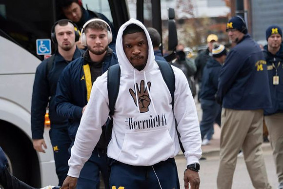 Karan Higdon (22), Shea Patterson (2), and Ben Mason (42)
