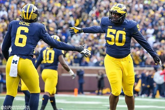 Josh Uche (6), Devin Bush (10), and Michael Dwumfour (50)