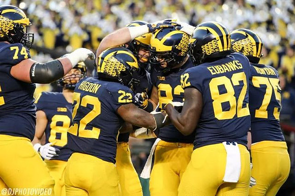 Ben Bredeson (74), Sean McKeon (84), Karan Higdon (22), Zach Gentry (83), Nick Eubanks (82), and Jon Runyan Jr. (75)