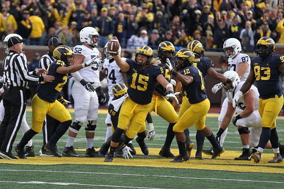 Tyree Kinnel (23), Kwity Paye (19), Chase Winovich (15), Aubrey Solomon (5), Josh Ross (12), Khaleke Hudson (7), and Lawrence Marshall (93)