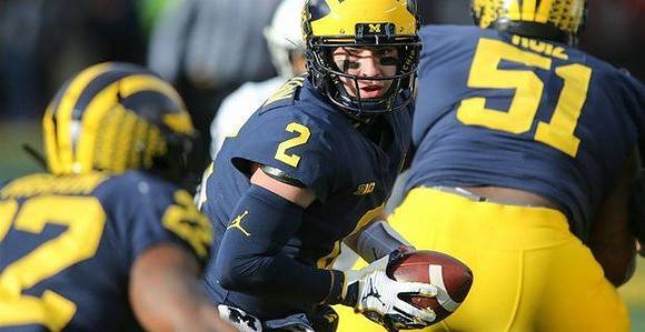Karan Higdon (22), Shea Patterson (2), and Cesar Ruiz (51)